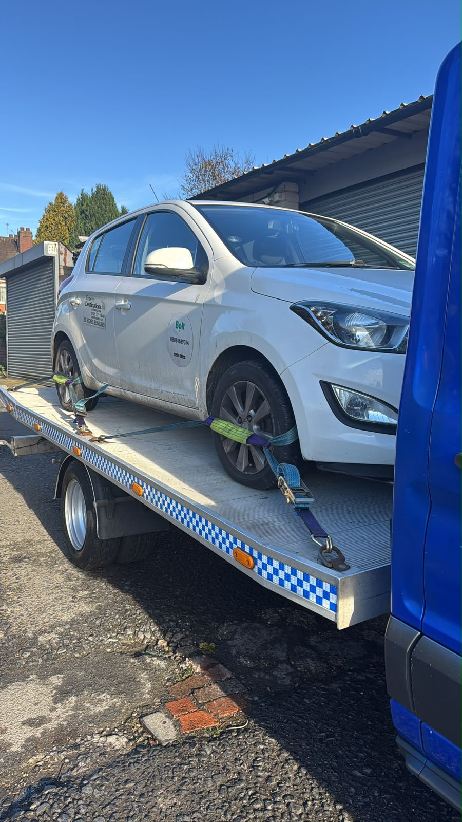 Car recovery flatbed loading a vehicle in Birmingham